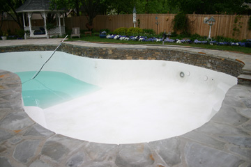 Pool plastered and filling with water