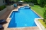 Angular pool with a spa and salt finish concrete.