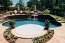 Pool with a bowl shaped lounge area built in.