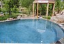 Infinity edge pool with wood decking below.