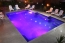 A beautiful geometric shaped pool with colored lights