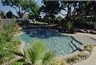 Pool with beach entry and pebble finish.