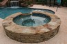 Raised spa with stone exterior