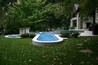 Lap pool with tiled spa and fire bowls.