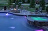 Laminar jets with L.E.D. lights shooting into pool.