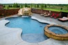 Pool with a spa and a waterfall.