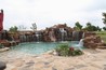 Sandstone boulder waterfalls with flagstone decking