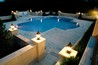 Formal pool with travertine decking.