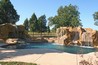 A pool with GFRC (faux rock) waterfalls and grotto.